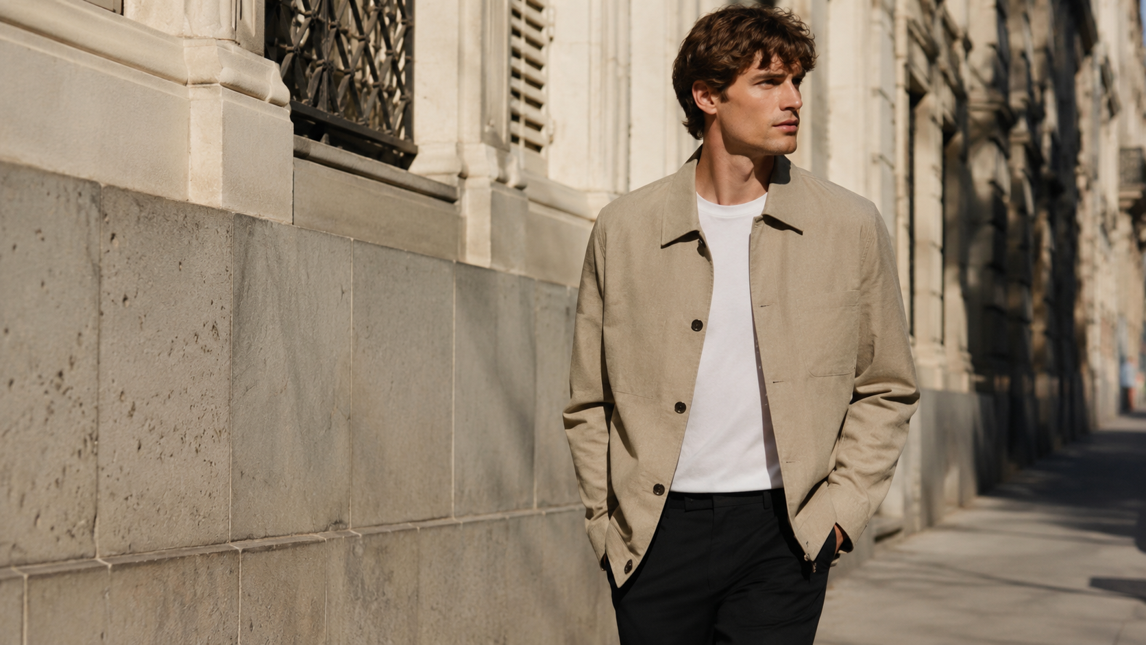 Man in beige jacket on European street
